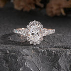 Oval Diamond Halo and Two-Stone Engagement Ring in Rose Gold