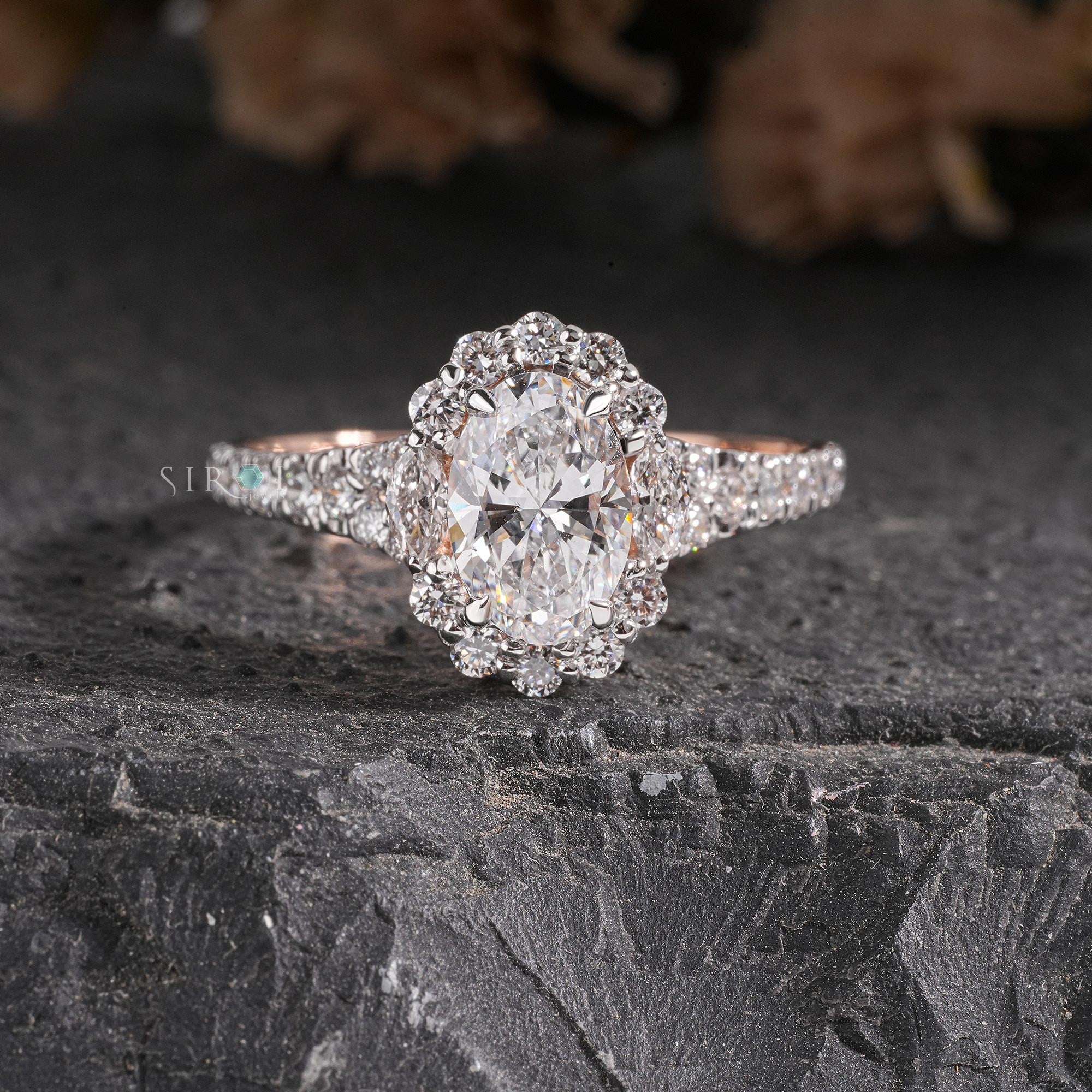 Oval Diamond Halo and Two-Stone Engagement Ring in Rose Gold