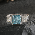 Princess Cut Blue Topaz and Diamond Three-Stone Engagement Ring in White Gold