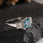Princess Cut Blue Topaz and Diamond Three-Stone Engagement Ring in White Gold