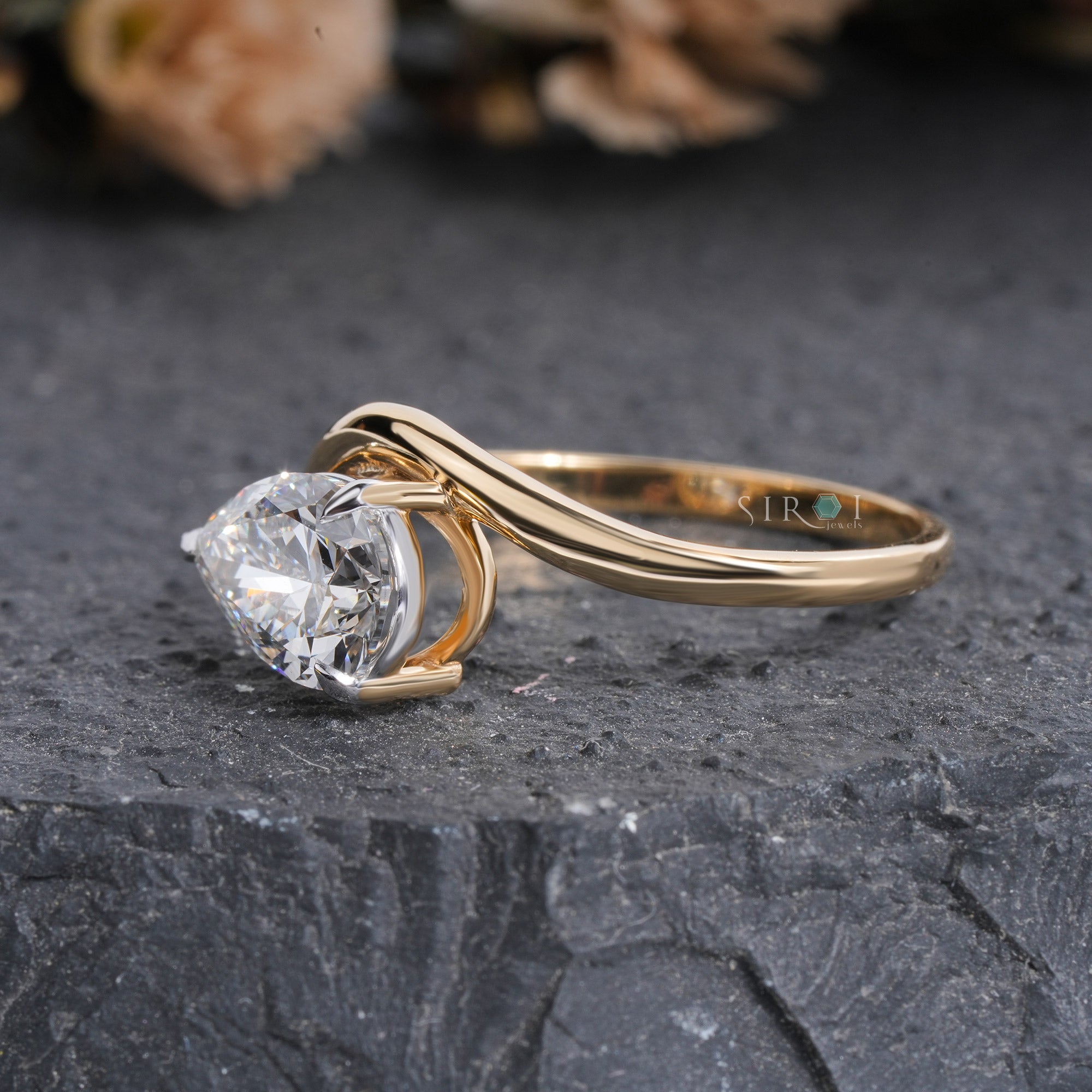 "Unique Pear Diamond Solitaire with Wavy Band"
