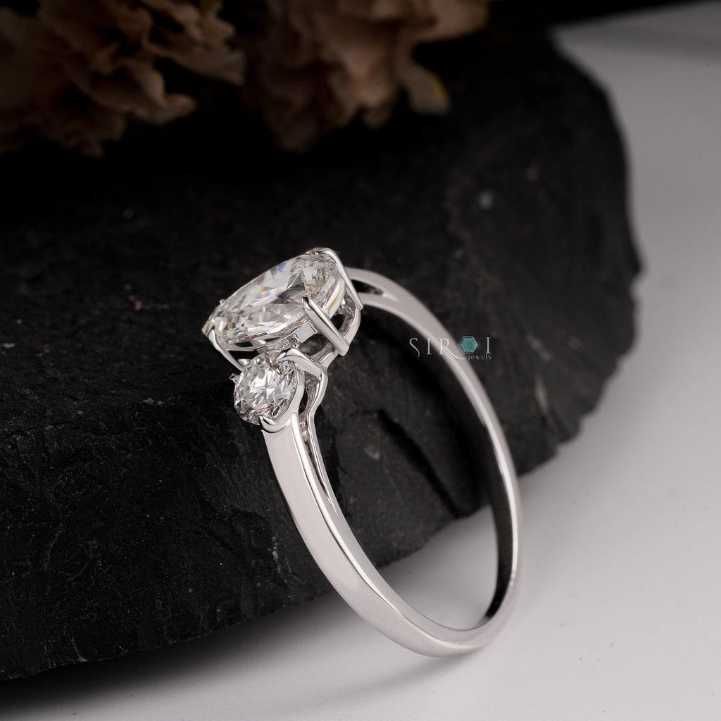 Elegant Pear and Round Three-Stone Diamond Engagement Ring in White Gold