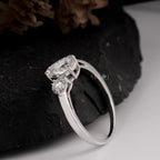 Elegant Pear and Round Three-Stone Diamond Engagement Ring in White Gold