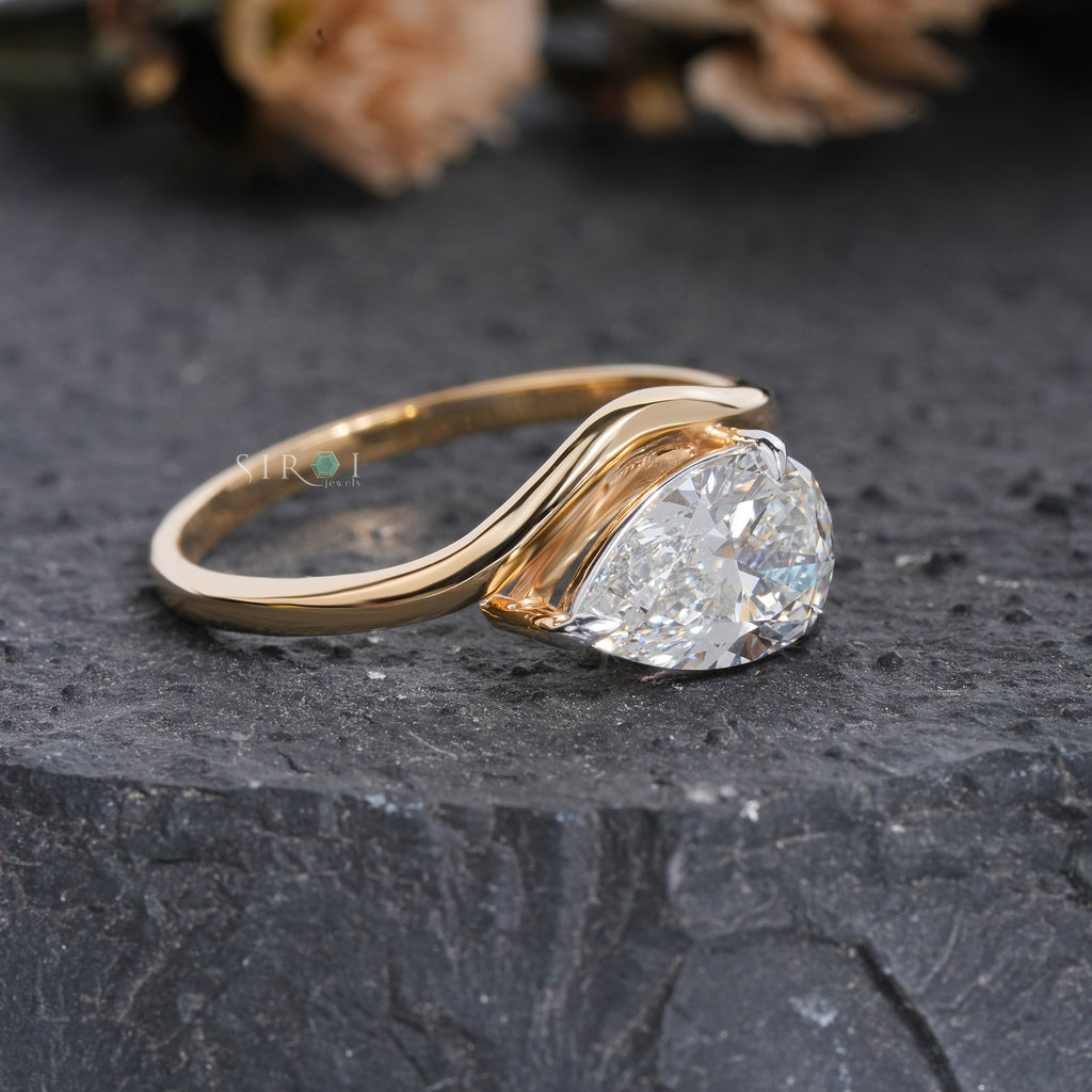 "Unique Pear Diamond Solitaire with Wavy Band"