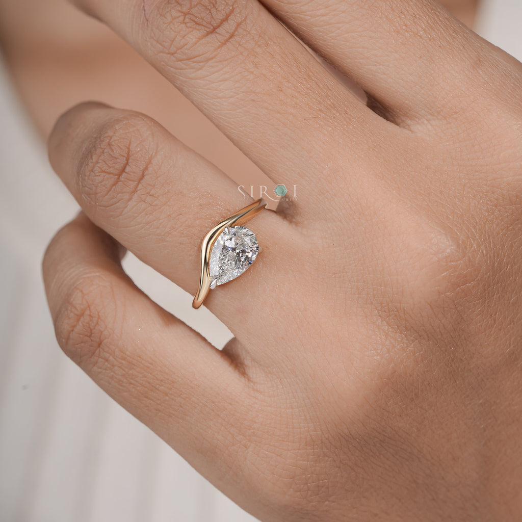 "Unique Pear Diamond Solitaire with Wavy Band"