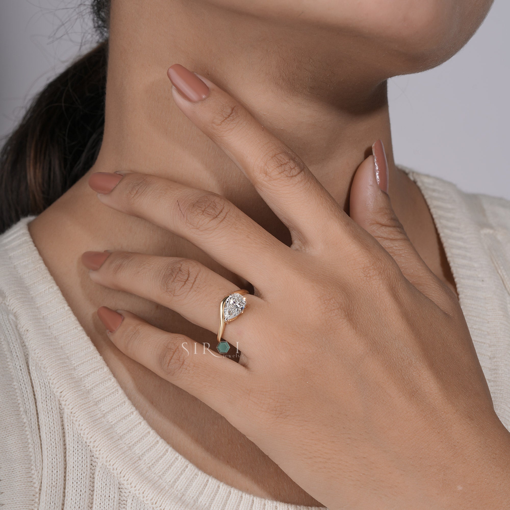 "Unique Pear Diamond Solitaire with Wavy Band"