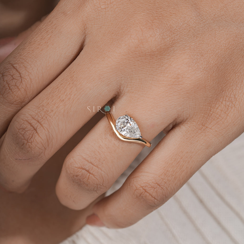 "Unique Pear Diamond Solitaire with Wavy Band"