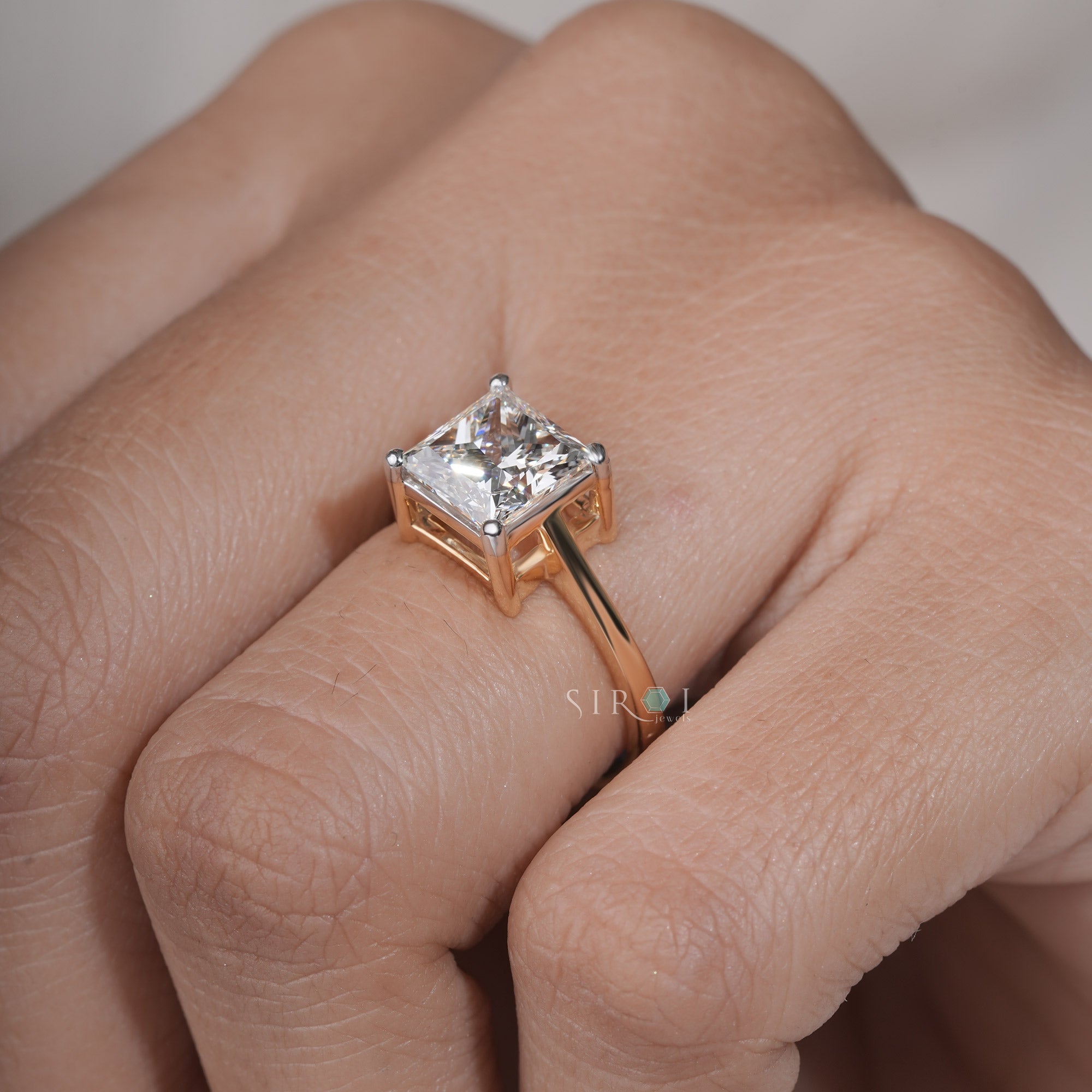 The Eternal Sparkle: Princess Cut Diamond Solitaire with Two-Tone Gold Setting