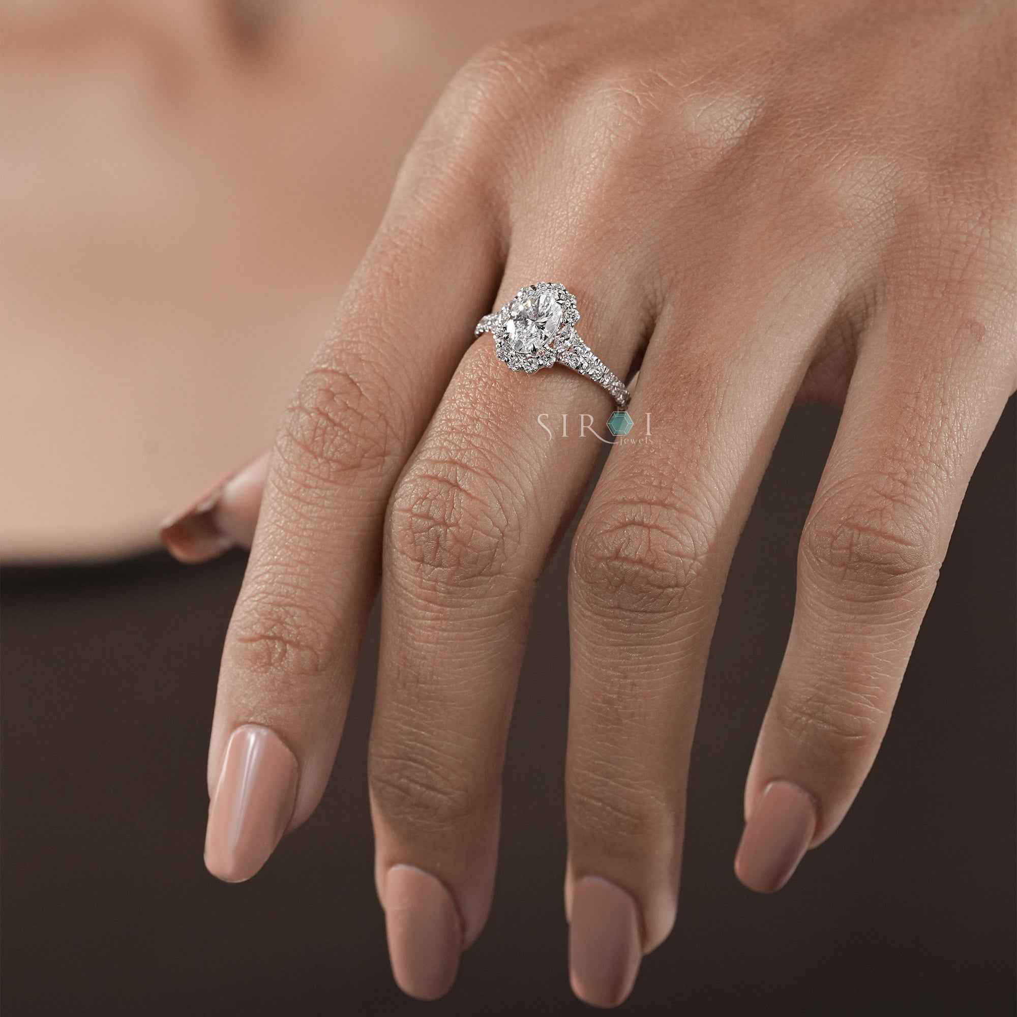 Oval Diamond Halo and Two-Stone Engagement Ring in Rose Gold