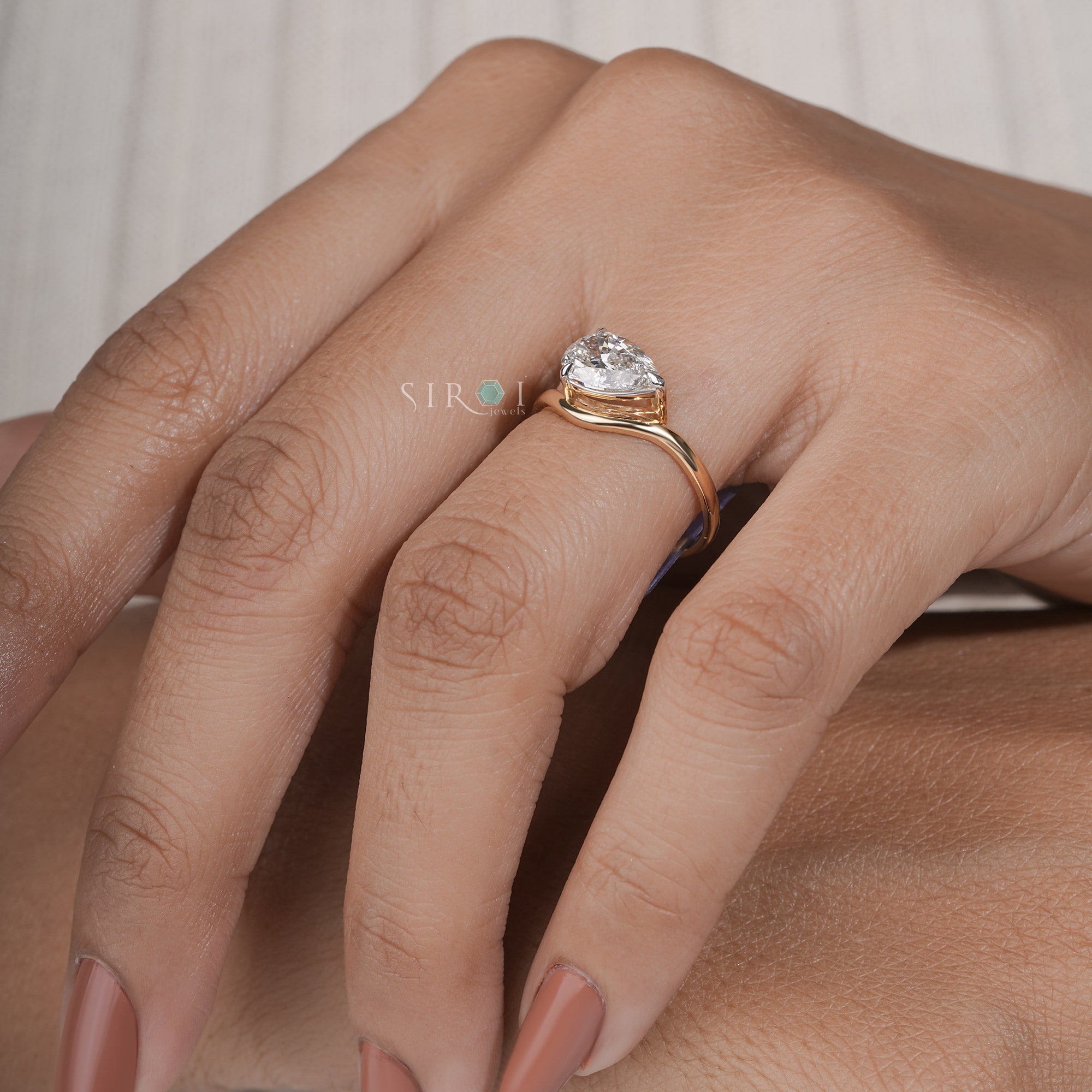 "Unique Pear Diamond Solitaire with Wavy Band"