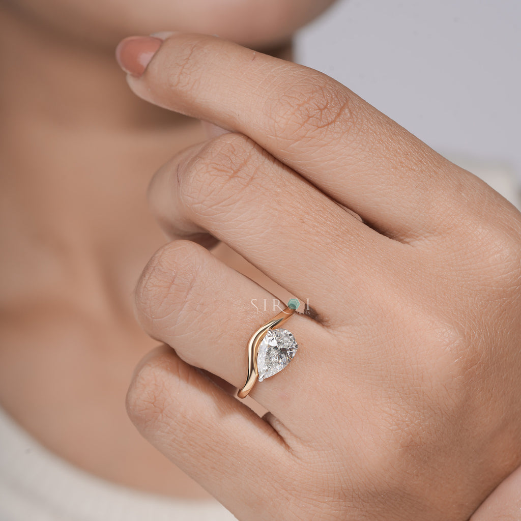 "Unique Pear Diamond Solitaire with Wavy Band"